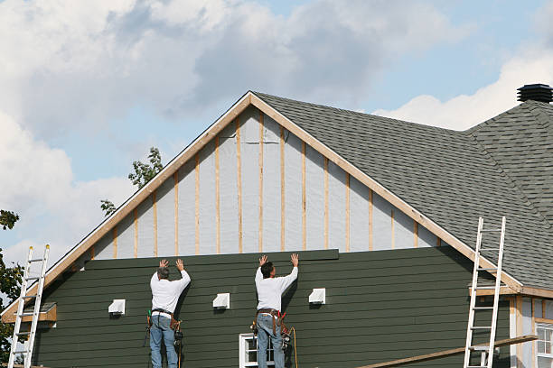 Professional Vinyl Siding technician working in Braddock, PA